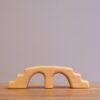 Bikeho Waldorf toy wooden bridge for nature table decoration.