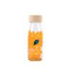 Petit Boum sensory bottle with floating bubbles and a blue fish inside.
