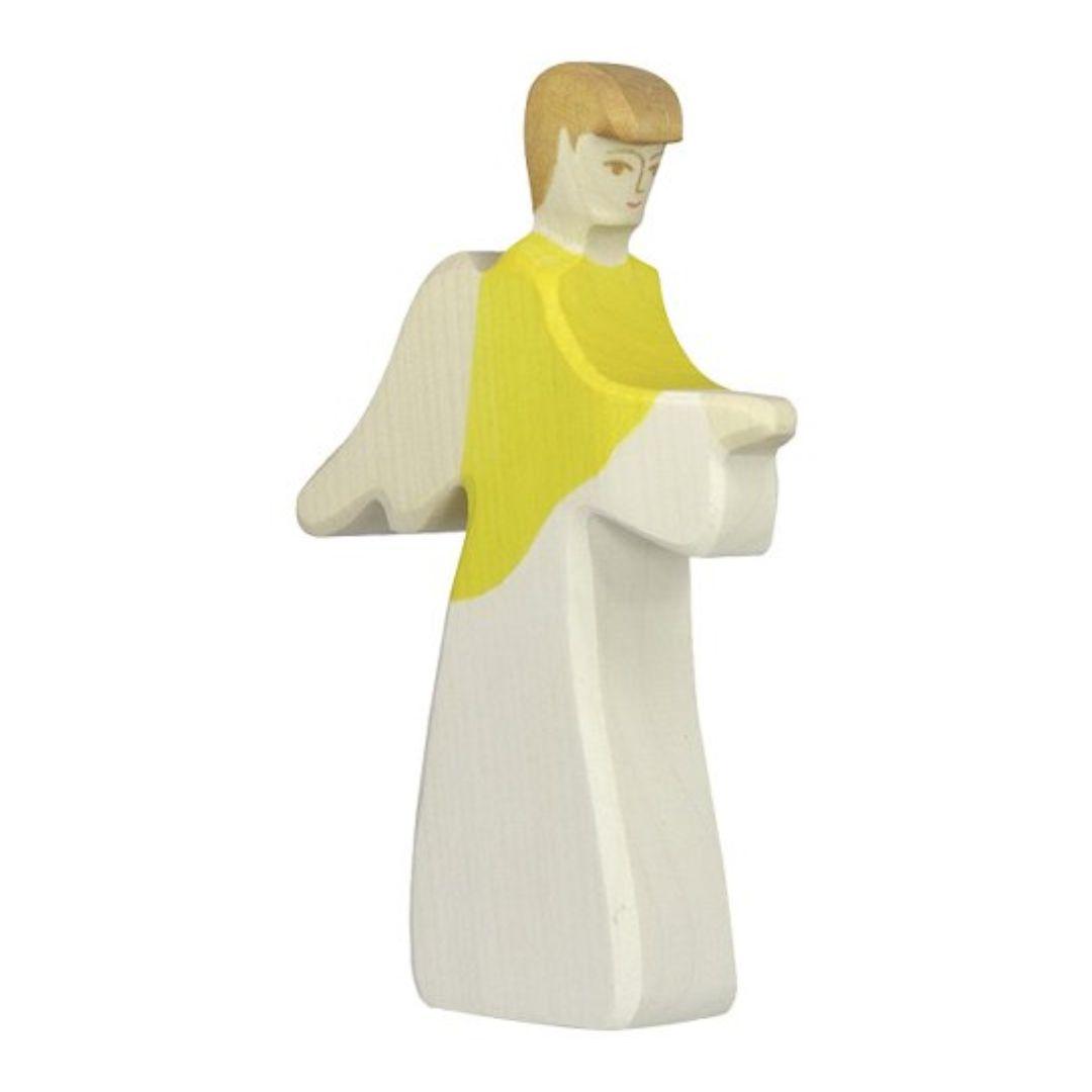 Handcrafted Holztiger archangel figure with wings and yellow and white dress for nativity scene.