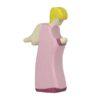 Handcrafted Holztiger archangel figure with wings and yellow and white dress for nativity scene.