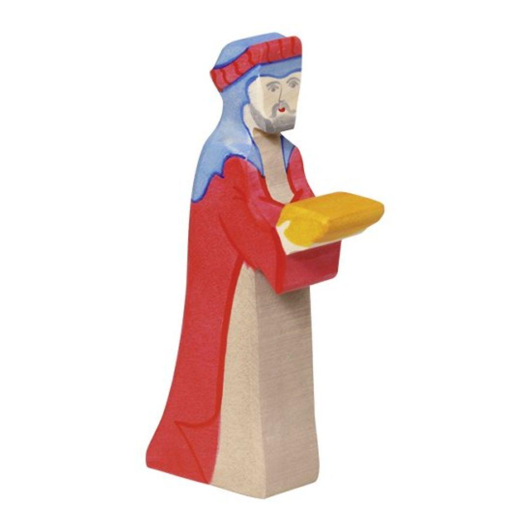 Handcrafted Holztiger wooden figure featuring Caspar from the three kings, wearing a red robe and bringing a gift. Perfect addition to nativity scenes.