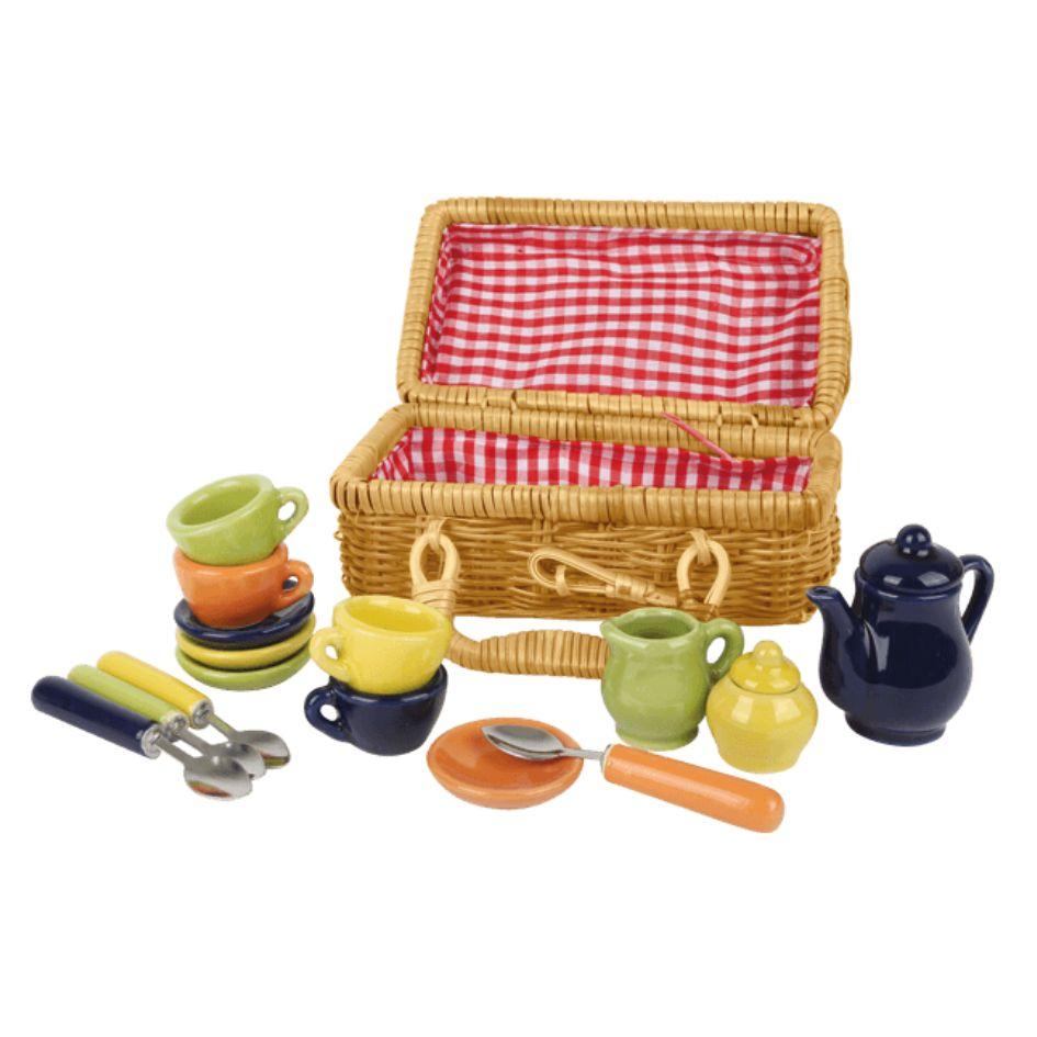 Vintage-style dollhouse tea set made of porcelain in different colours and in brown woven basket.